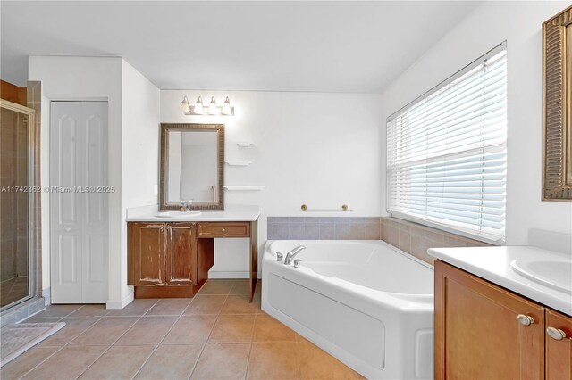 207 Berenger Walk, Royal Palm Beach, FL 33414 - bathroom with tile patterned flooring, a sink, a bath, two vanities, and a stall shower