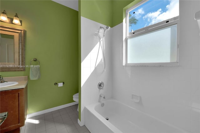 207 Berenger Walk, Royal Palm Beach, FL 33414 - full bath with two vanities, a garden tub, tile patterned floors, and a sink
