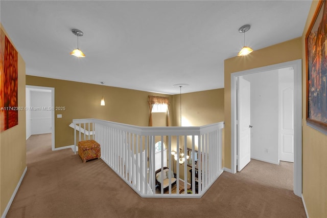 207 Berenger Walk, Royal Palm Beach, FL 33414 - hallway featuring carpet floors, baseboards, and an upstairs landing