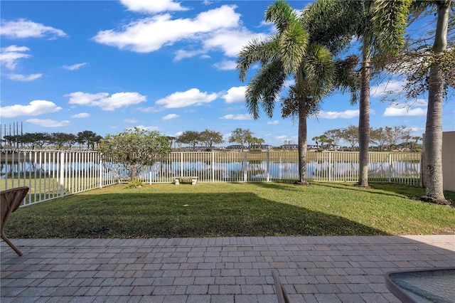 207 Berenger Walk, Royal Palm Beach, FL 33414 - view of patio / terrace with a fenced backyard and a water view