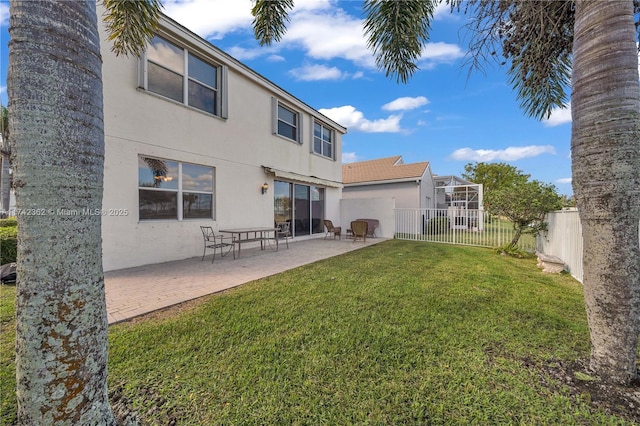 207 Berenger Walk, Royal Palm Beach, FL 33414 - rear view of house with a patio, a fenced backyard, a yard, and stucco siding