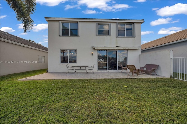 207 Berenger Walk, Royal Palm Beach, FL 33414 - rear view of house featuring a patio area, a lawn, and stucco siding