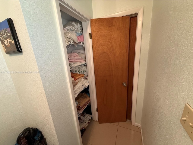 11277 SW 172nd St Unit I1742D, Miami, FL 33157 - hall featuring tile patterned flooring and a textured wall