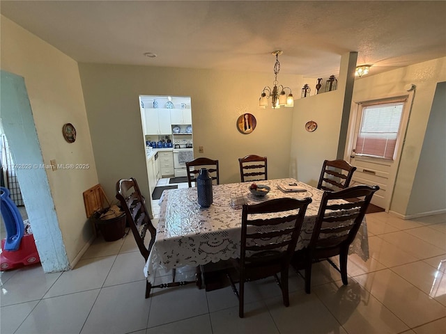 11277 SW 172nd St Unit I1742D, Miami, FL 33157 - dining space featuring a chandelier and light tile patterned flooring