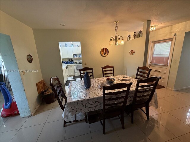 11277 SW 172nd St Unit I1742D, Miami, FL 33157 - dining area with a chandelier and light tile patterned floors