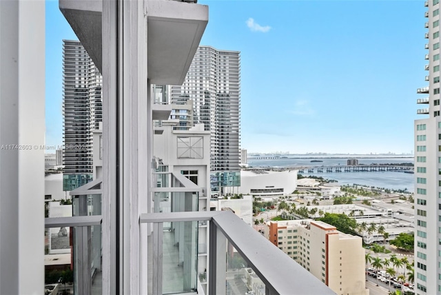 balcony featuring a water view