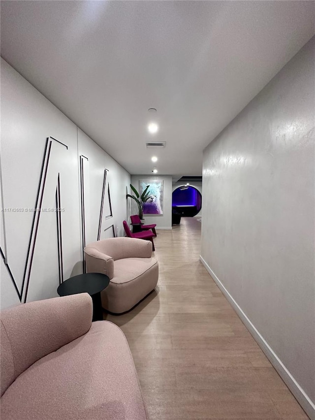 corridor featuring light hardwood / wood-style floors