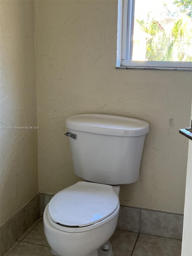 bathroom featuring tile patterned floors and toilet