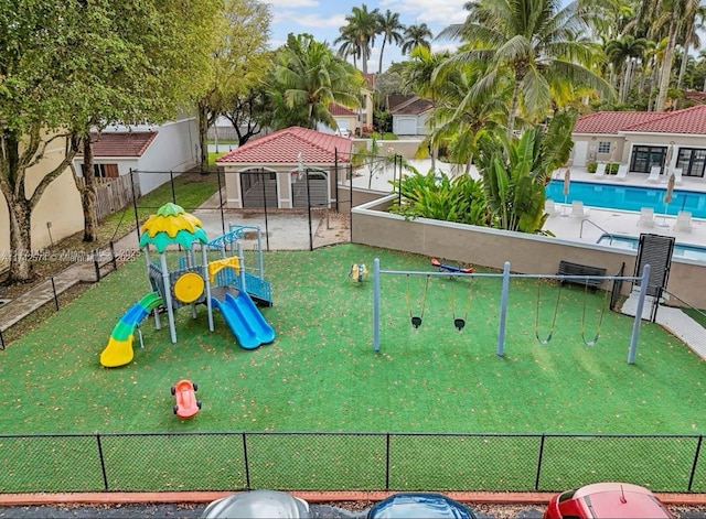 view of play area featuring a community pool and a gazebo