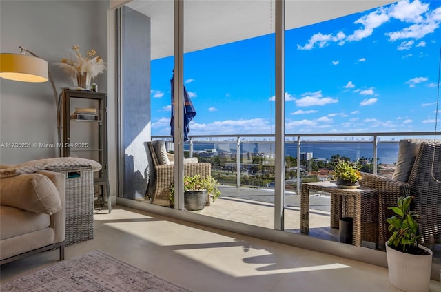 interior space featuring a water view and a healthy amount of sunlight