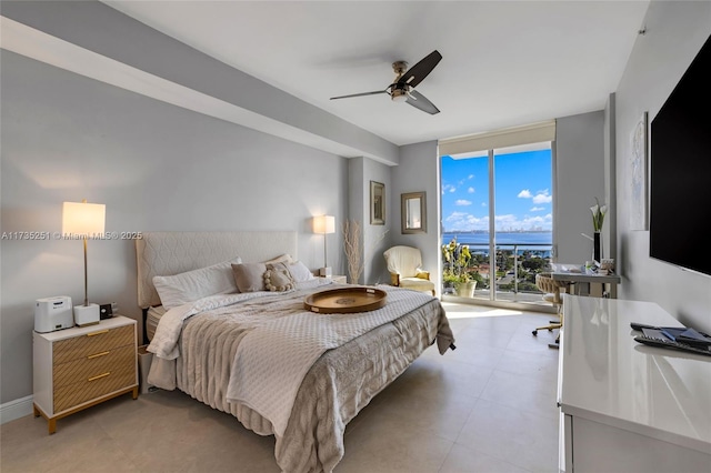 bedroom with access to outside, a ceiling fan, and a wall of windows
