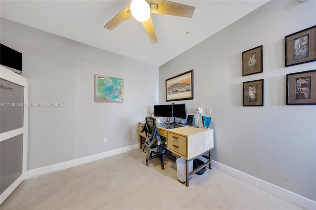 office space with baseboards and ceiling fan