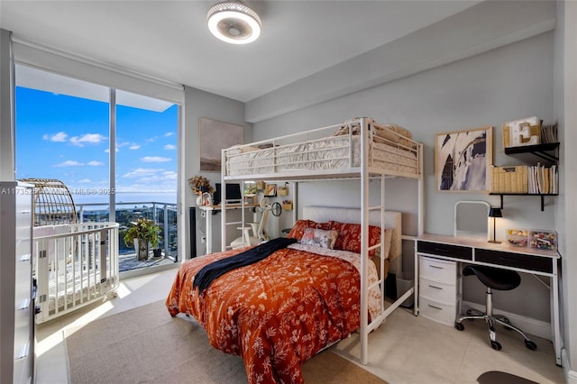 bedroom with floor to ceiling windows