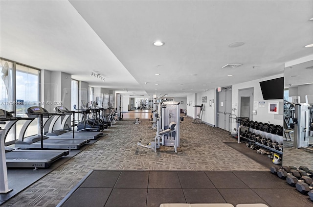 workout area with carpet floors, recessed lighting, and visible vents