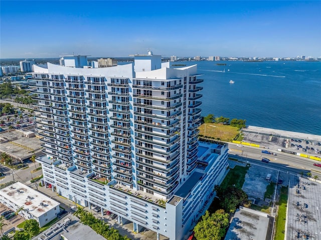 birds eye view of property with a water view