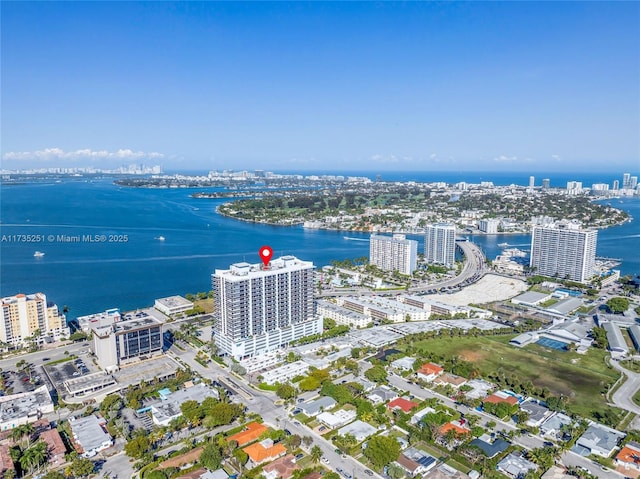 drone / aerial view with a view of city and a water view