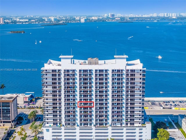 drone / aerial view with a view of city and a water view