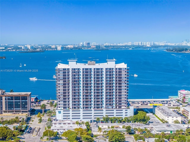 drone / aerial view with a view of city and a water view