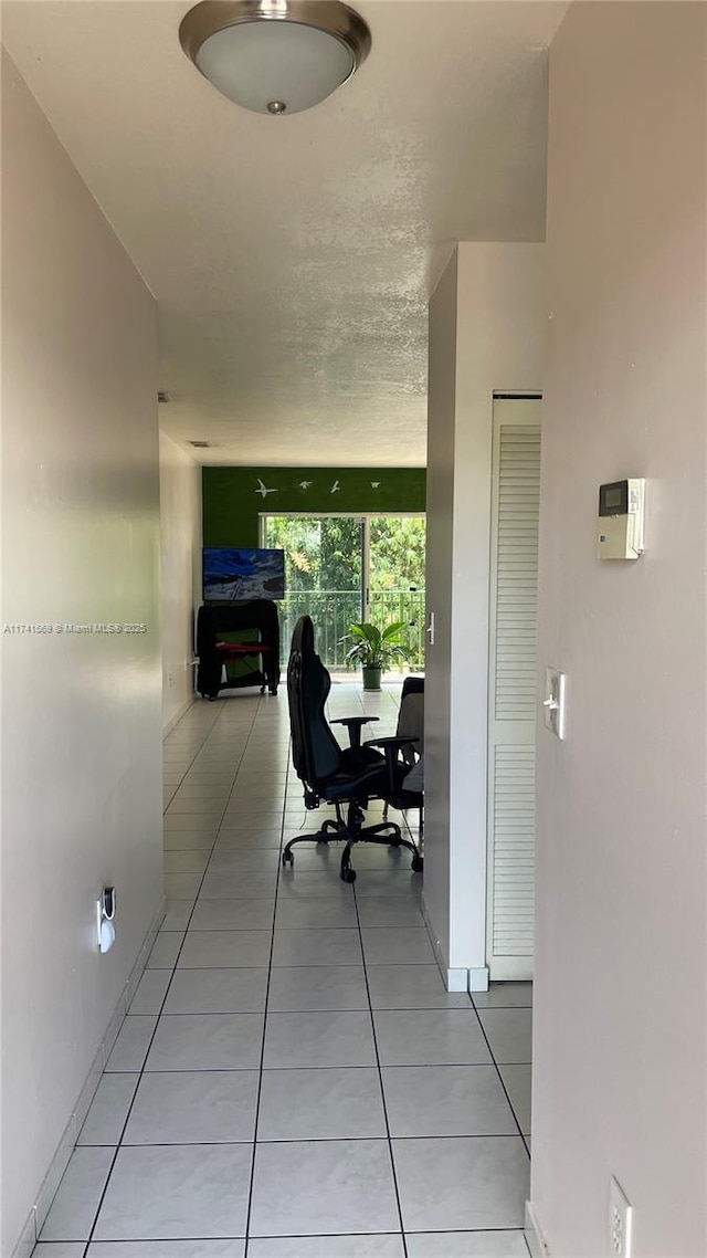 hallway with light tile patterned floors