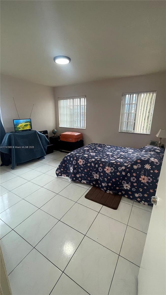 bedroom featuring tile patterned floors