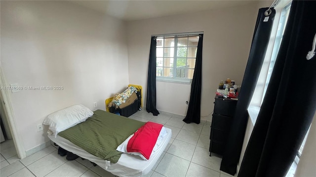 bedroom featuring light tile patterned floors