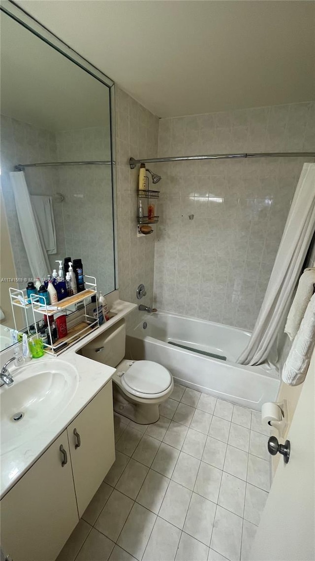 full bathroom with tile patterned flooring, vanity, toilet, and shower / bath combo