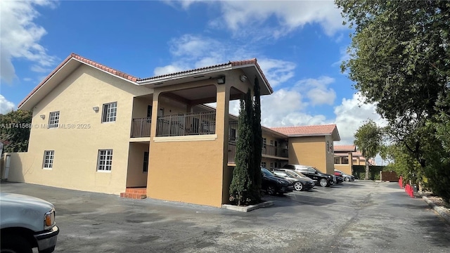 view of home's exterior featuring a balcony