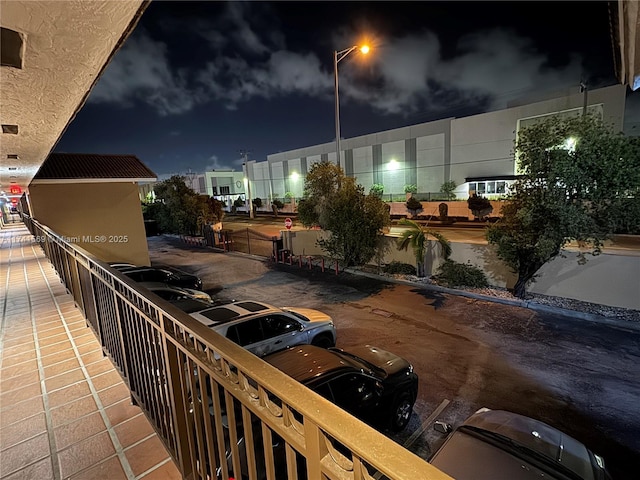 view of balcony at twilight