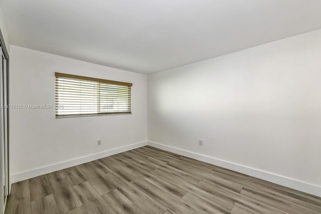 empty room with light wood-type flooring