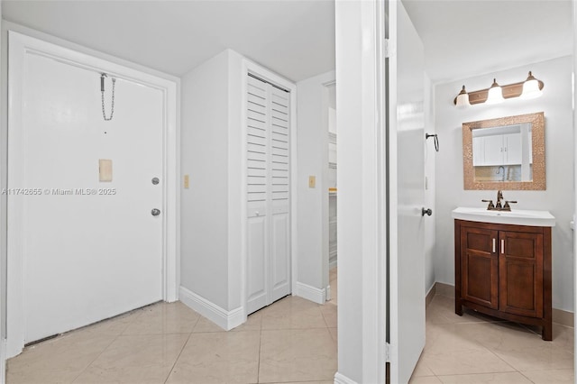 bathroom with tile patterned floors and vanity