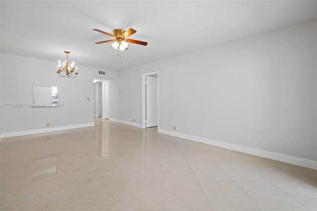 unfurnished room with ceiling fan with notable chandelier