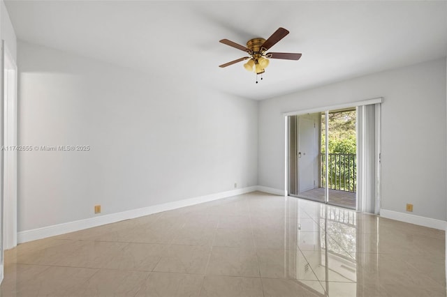 tiled spare room with ceiling fan