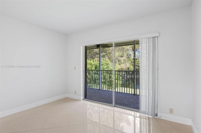 spare room featuring light tile patterned floors