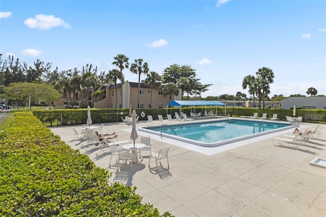 view of swimming pool featuring a patio area