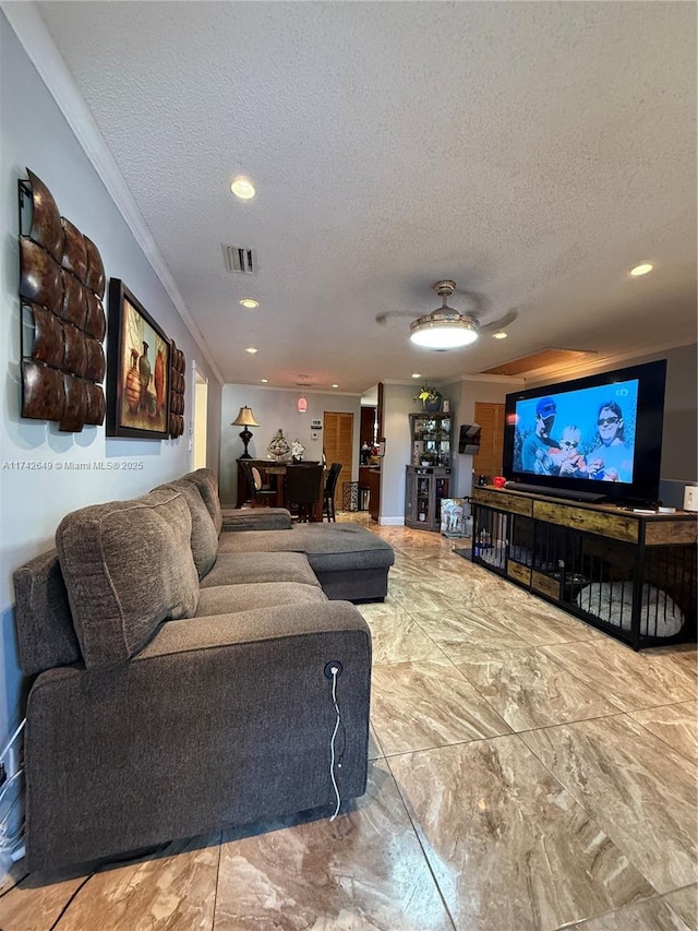 living room featuring crown molding and a textured ceiling