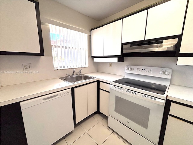 kitchen featuring sink, light tile patterned floors, white cabinets, and white appliances