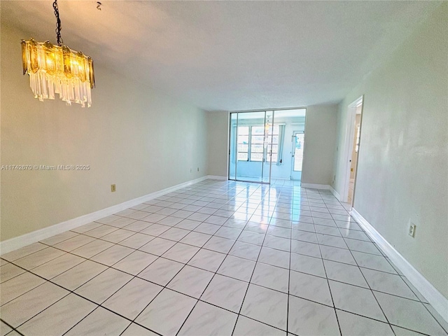 tiled empty room with a chandelier