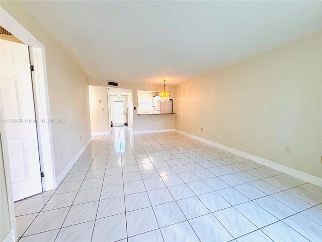 empty room with light tile patterned flooring