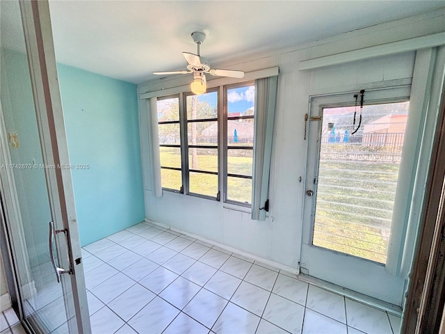 doorway with ceiling fan