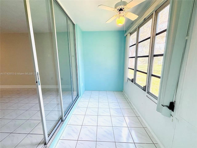 interior space featuring ceiling fan and a balcony