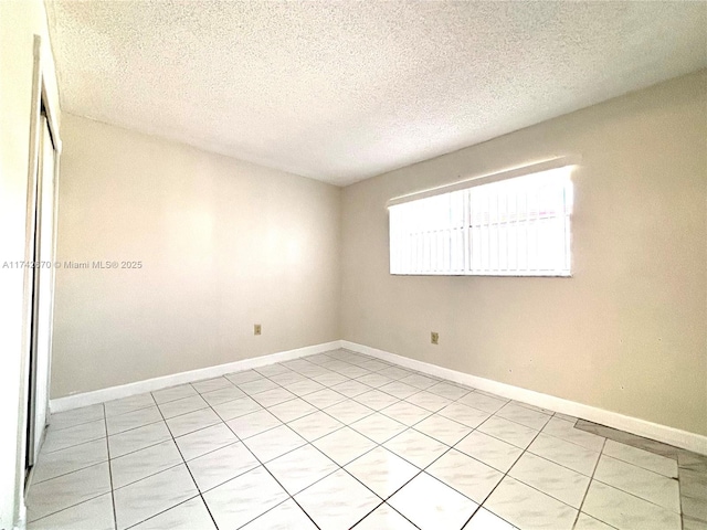 empty room with a textured ceiling