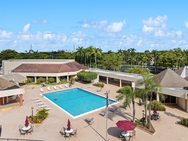 view of swimming pool with a patio