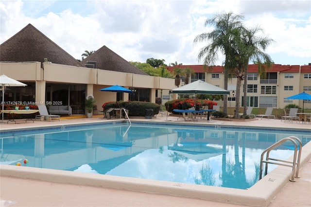 view of swimming pool featuring a gazebo and a patio area