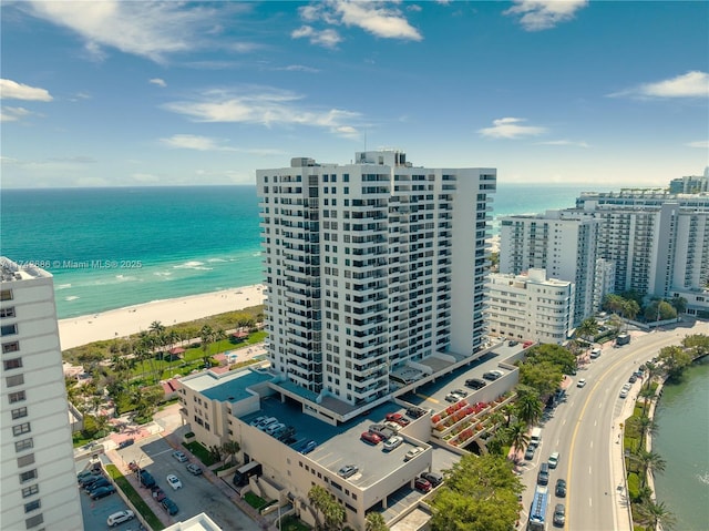 bird's eye view with a water view and a view of the beach