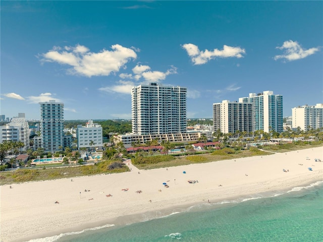 drone / aerial view with a view of the beach and a water view