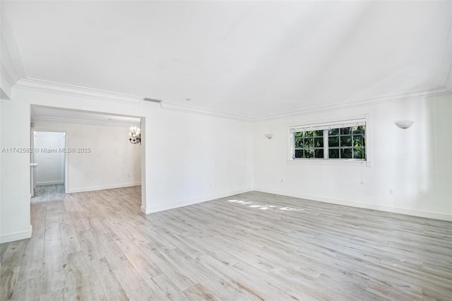 spare room with light hardwood / wood-style flooring and ornamental molding