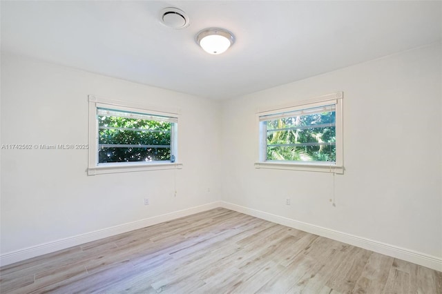 unfurnished room featuring light hardwood / wood-style flooring