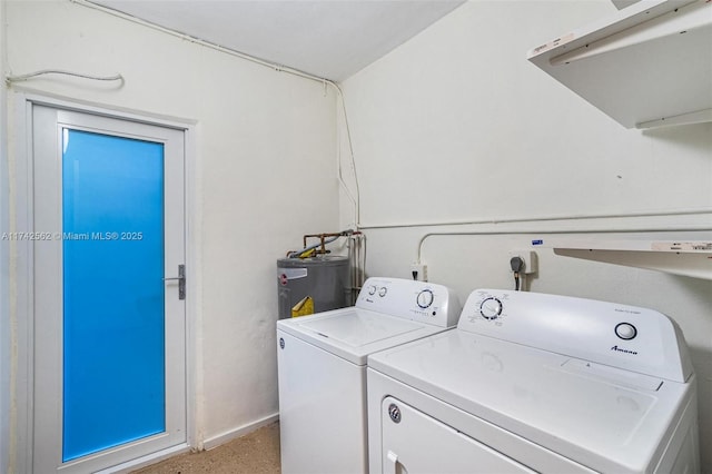 laundry room featuring washing machine and dryer and electric water heater