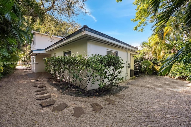 view of side of property with central AC