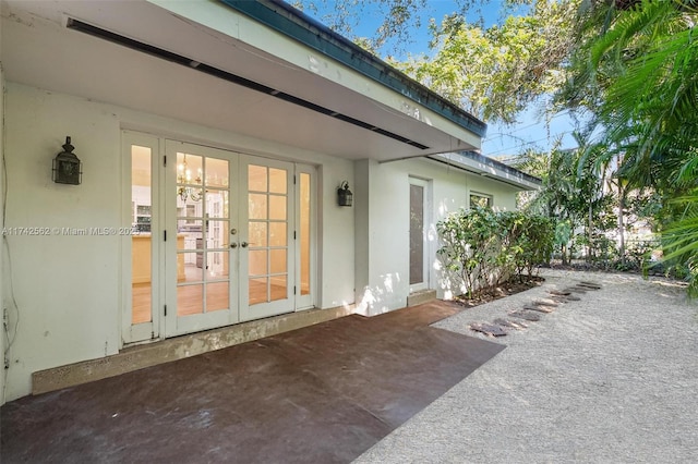 view of exterior entry featuring french doors